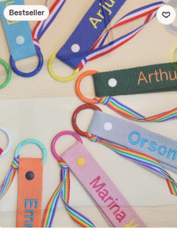 Embroidered fabric keyring tags in multiple colours with names