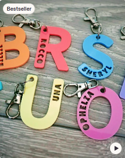 Bright acrylic letter-shaped personalised bag tags with swivel clips